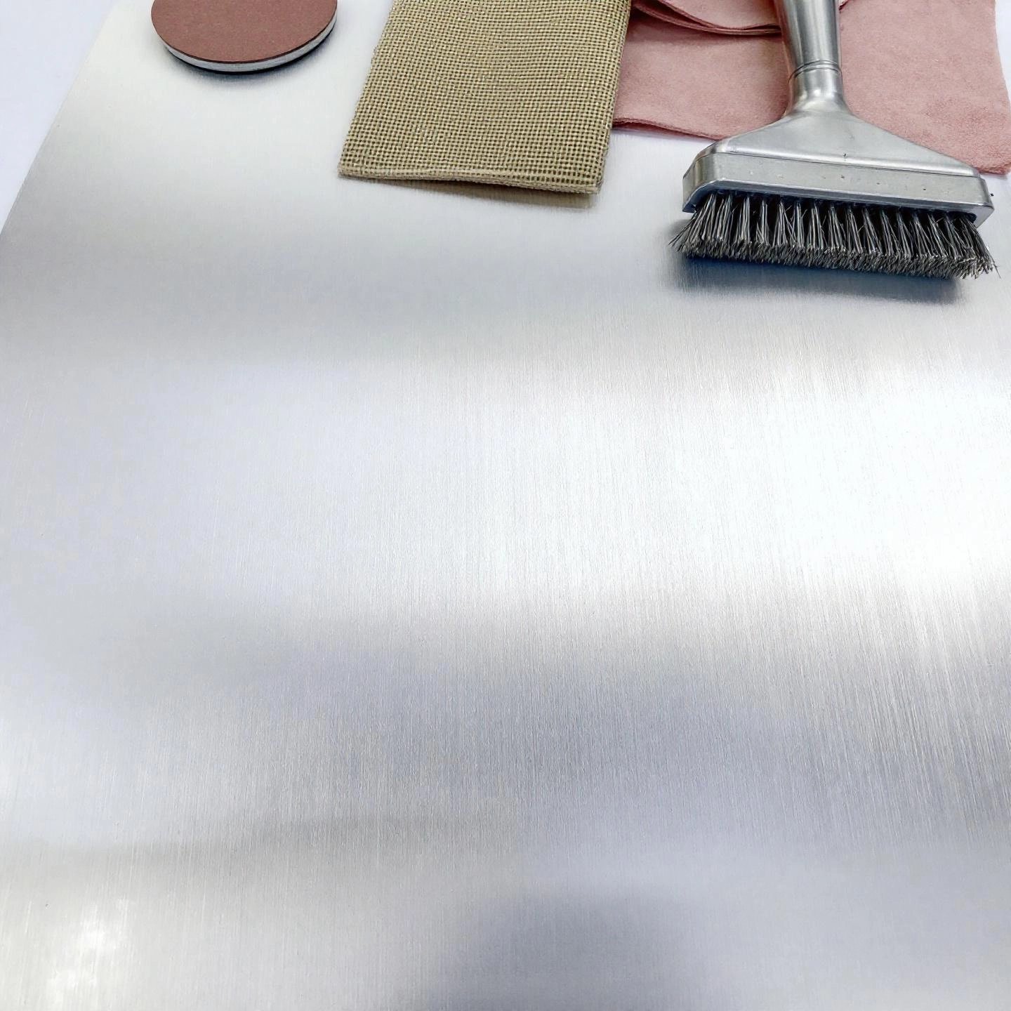 aluminum's natural oxide layer requires special cleaning and sanding before painting