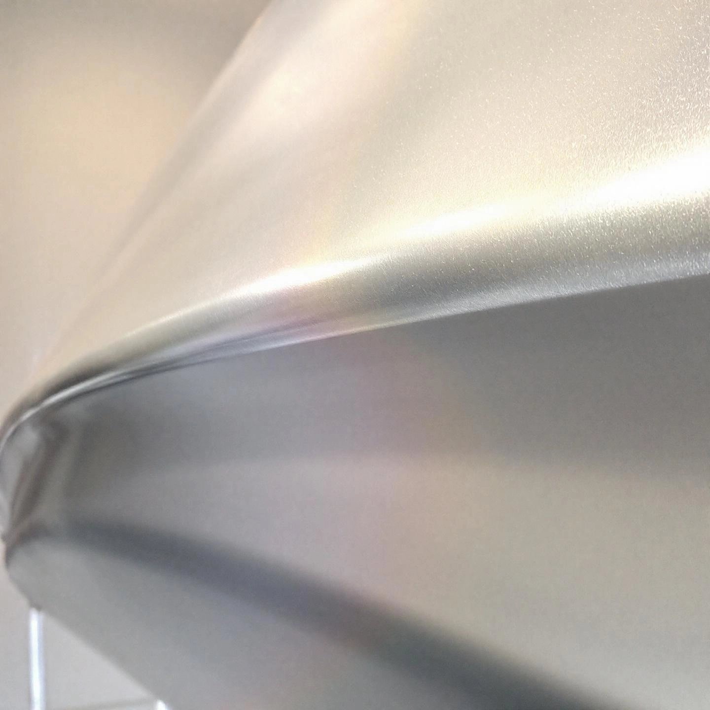 close up of an aluminum boat hull surface highlighting its unique painting challenges