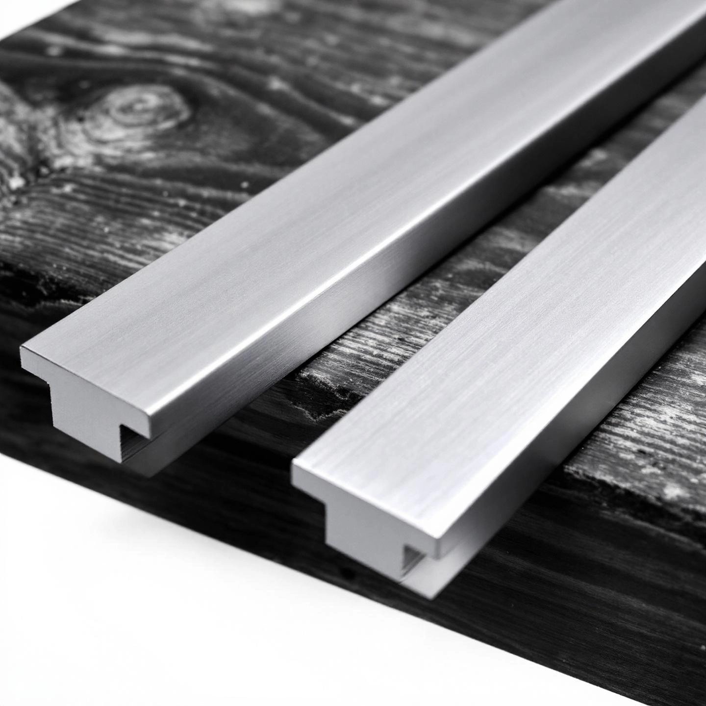 comparison of extruded and anodized aluminum straight edges showing finish differences