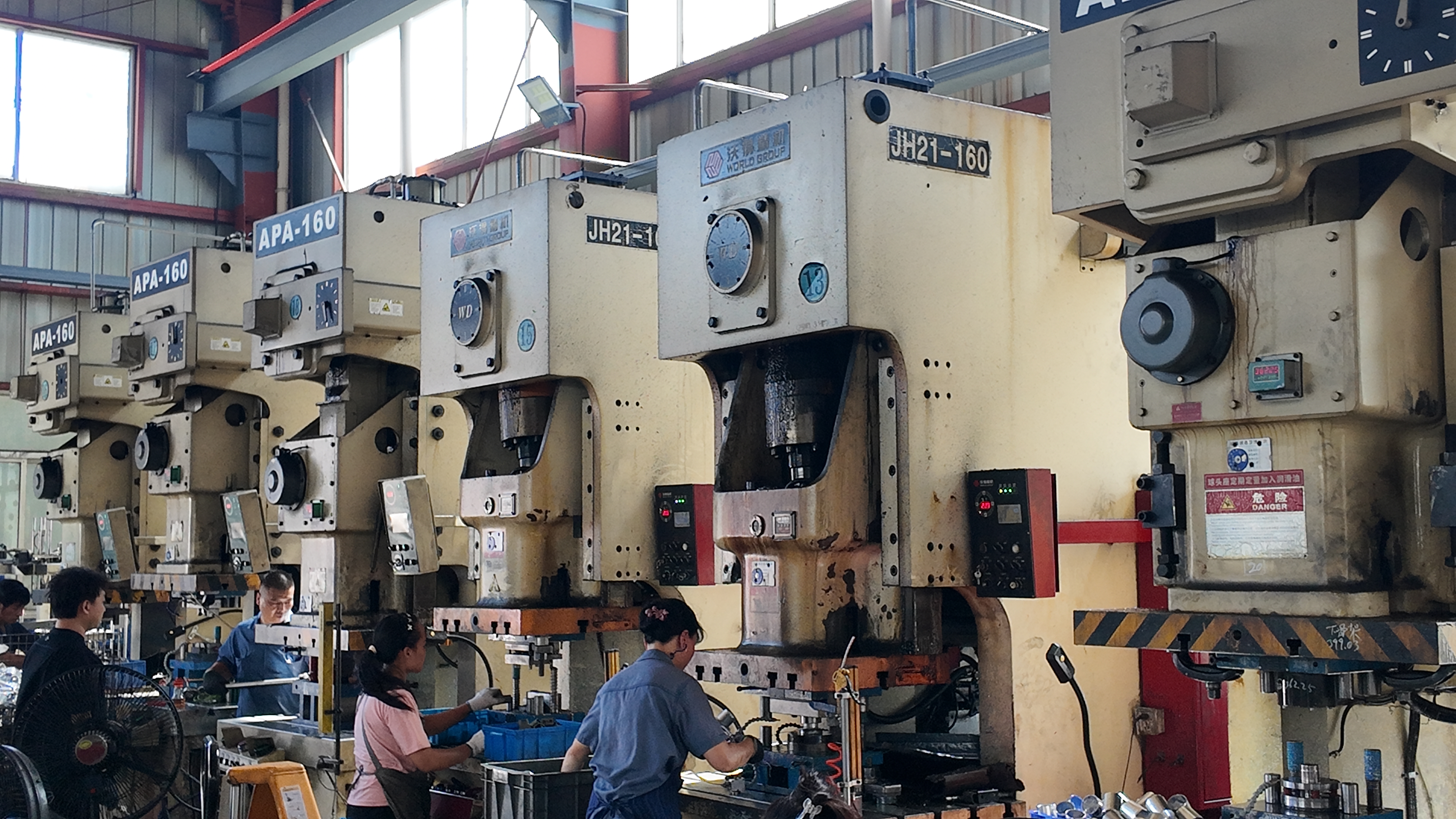 modern stamping press and die set in a precision manufacturing environment