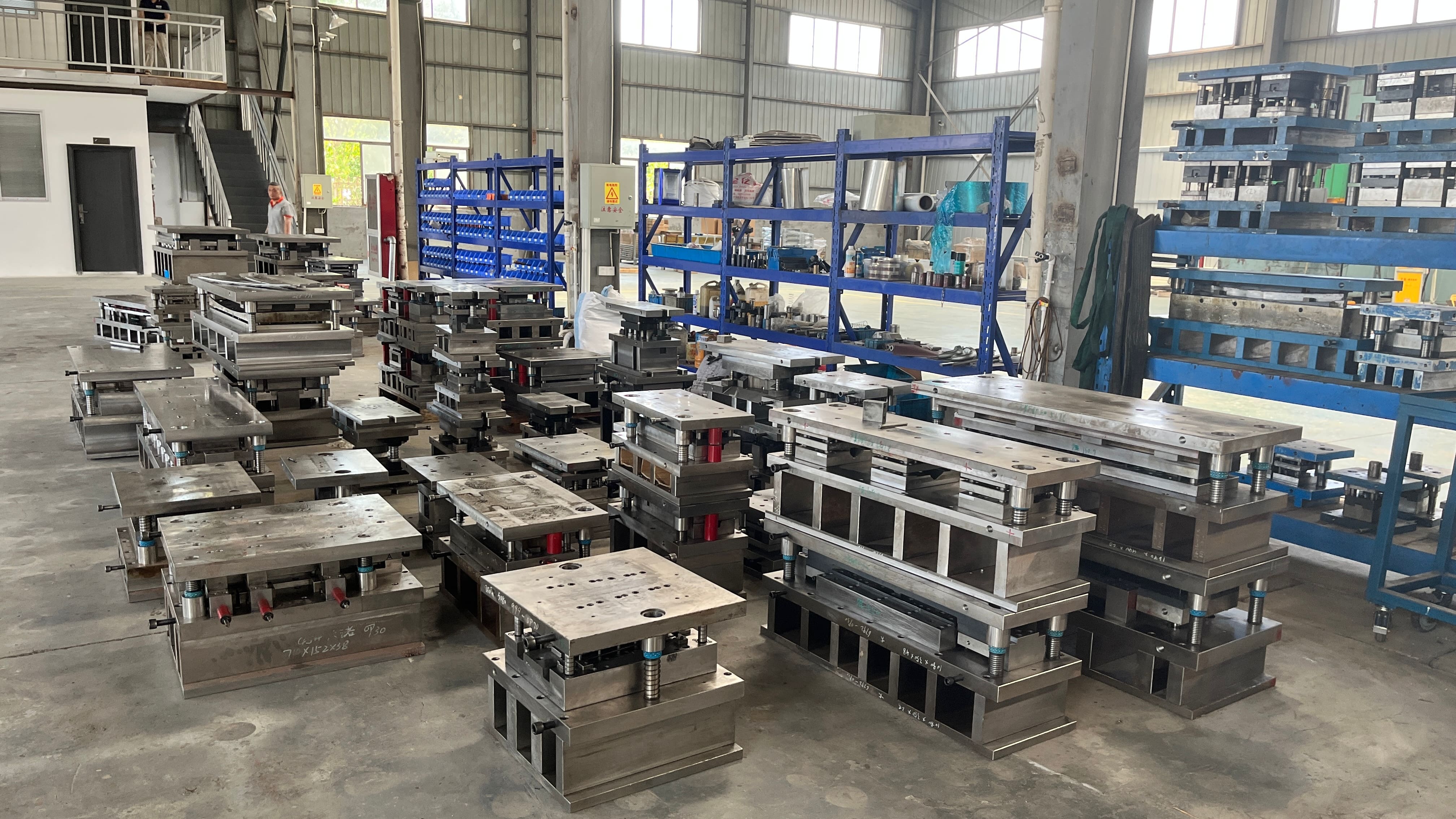 automotive stamping presses performing progressive transfer and deep draw operations