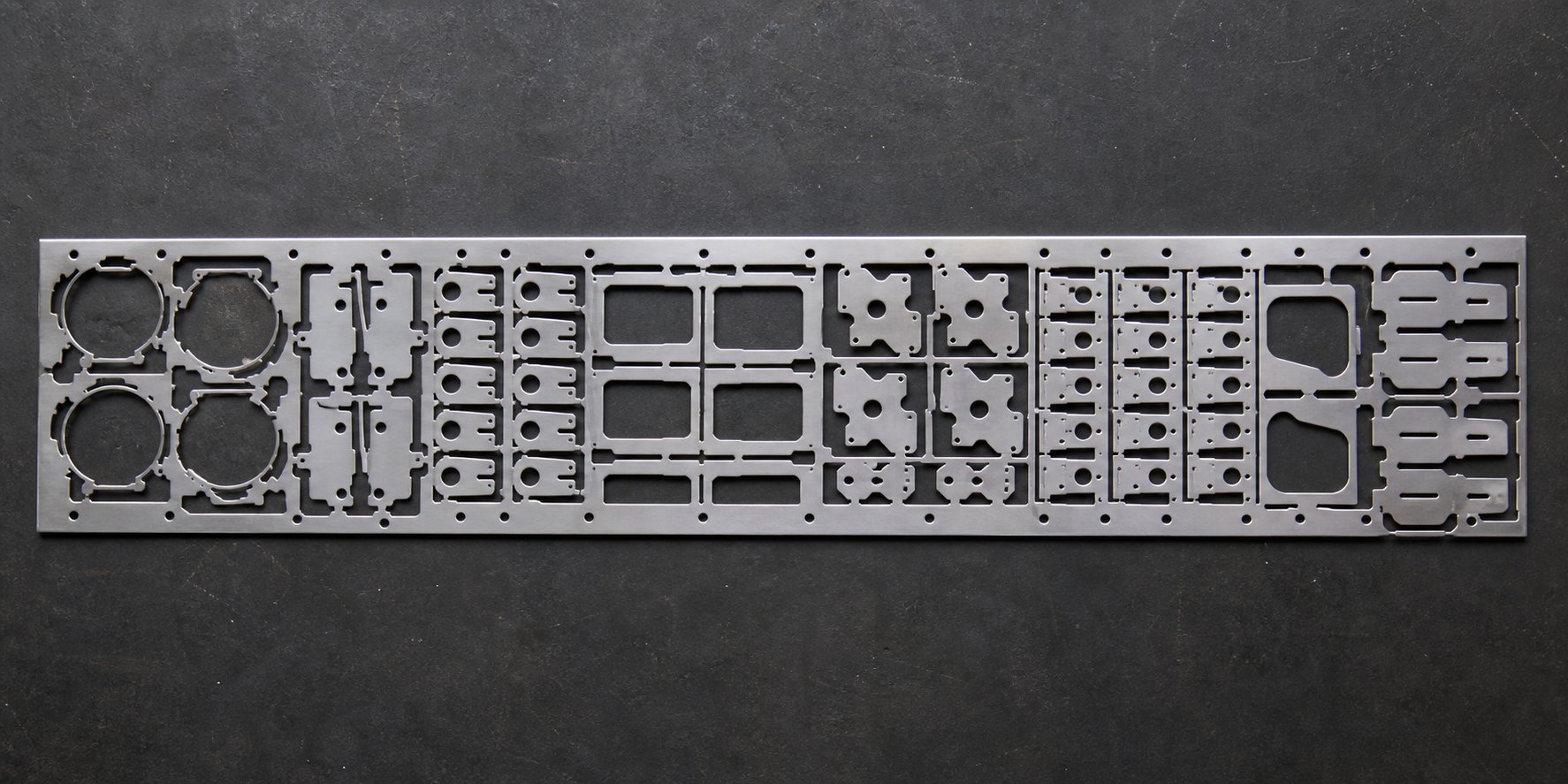 info-1-1 optimized strip layout showing nested part arrangement that maximizes material utilization and minimizes scrap in high volume progressive stamping