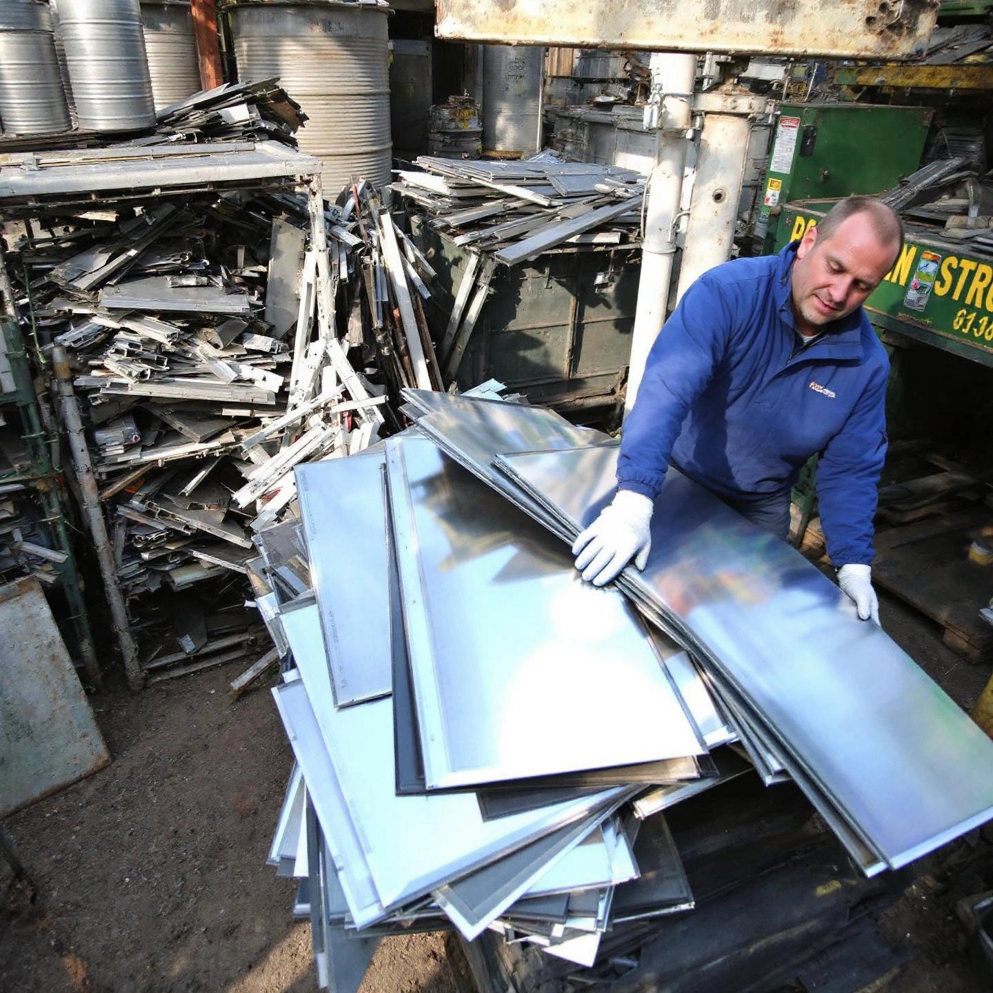 different types of aluminum scrap sorted for pricing at a local yard