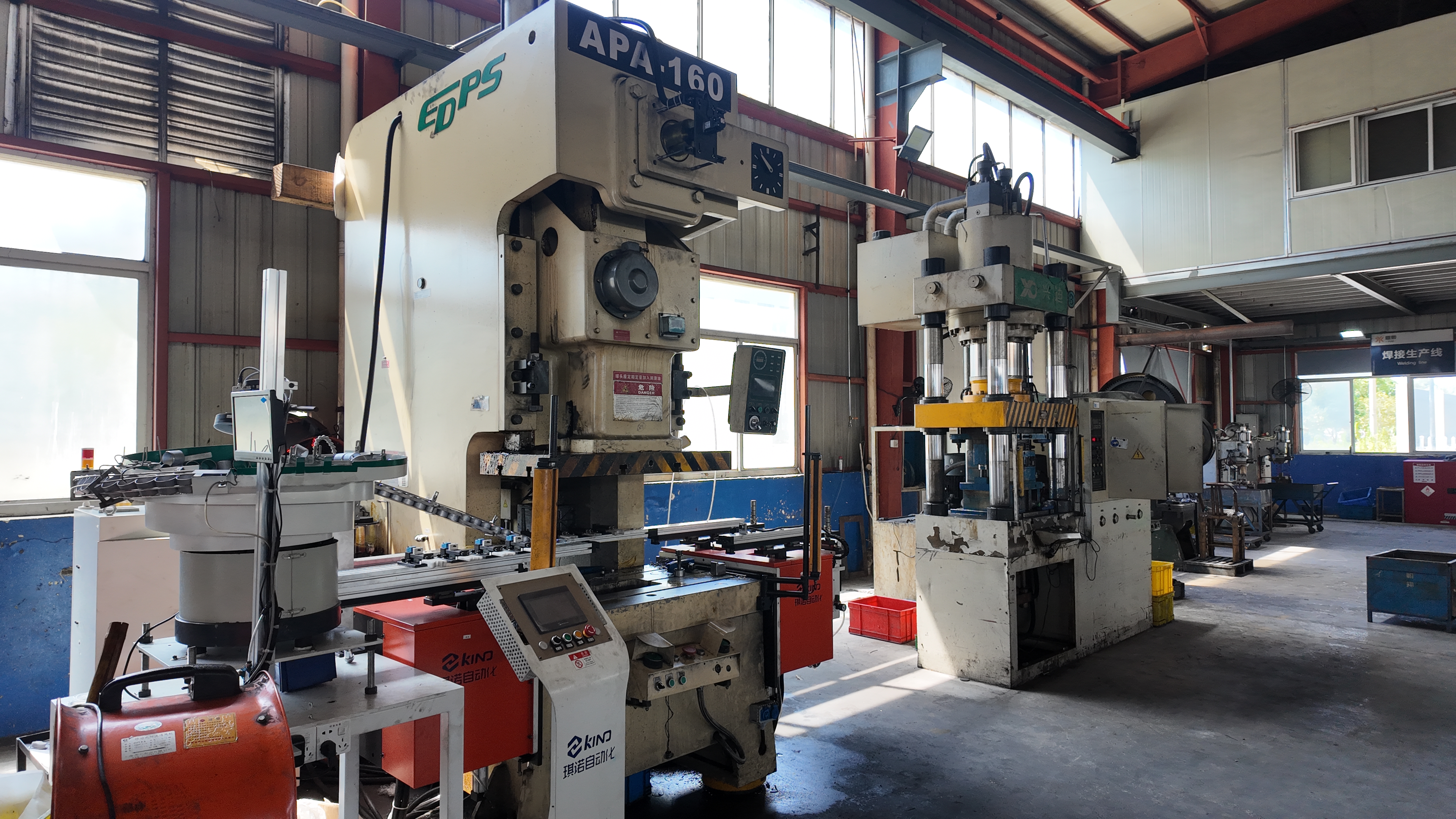 modern stamping press shaping sheet metal in a manufacturing facility