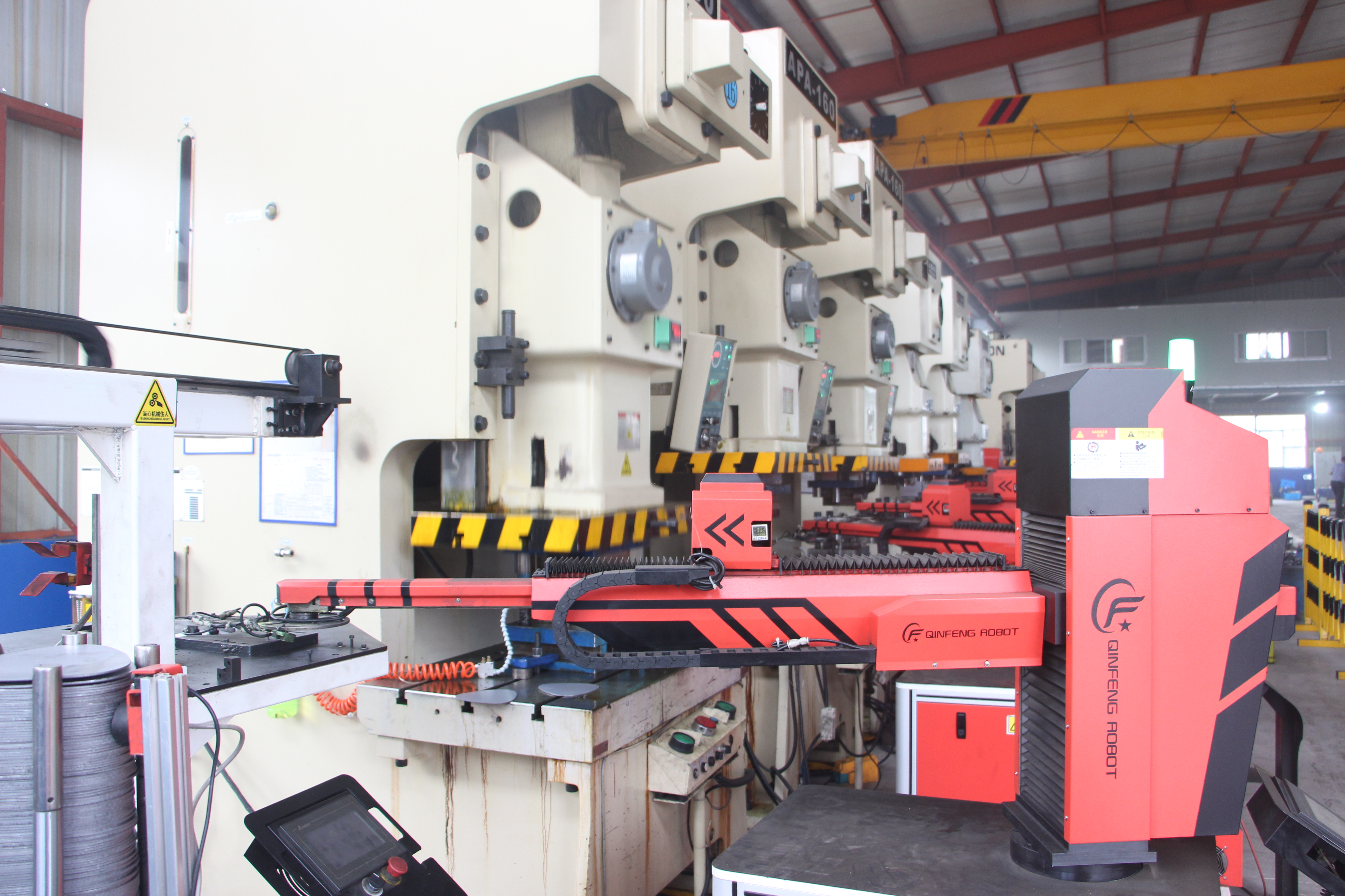 automotive metal stamping process in a modern factory environment