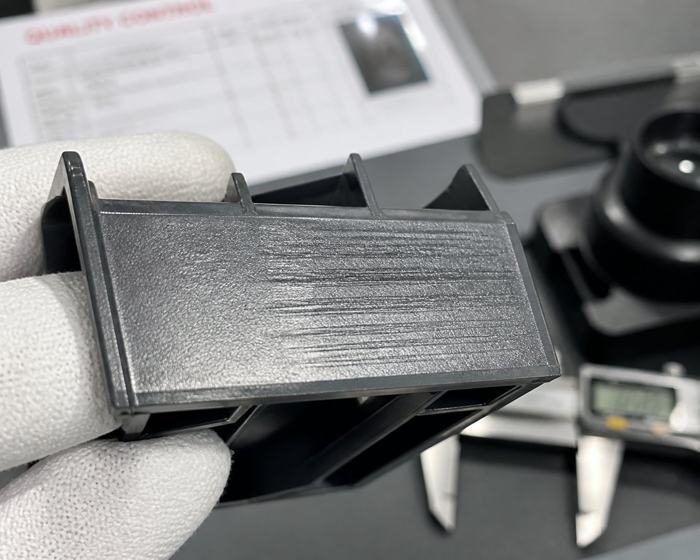 drag marks on a slide formed plastic surface caused by insufficient draft angle during mold retraction