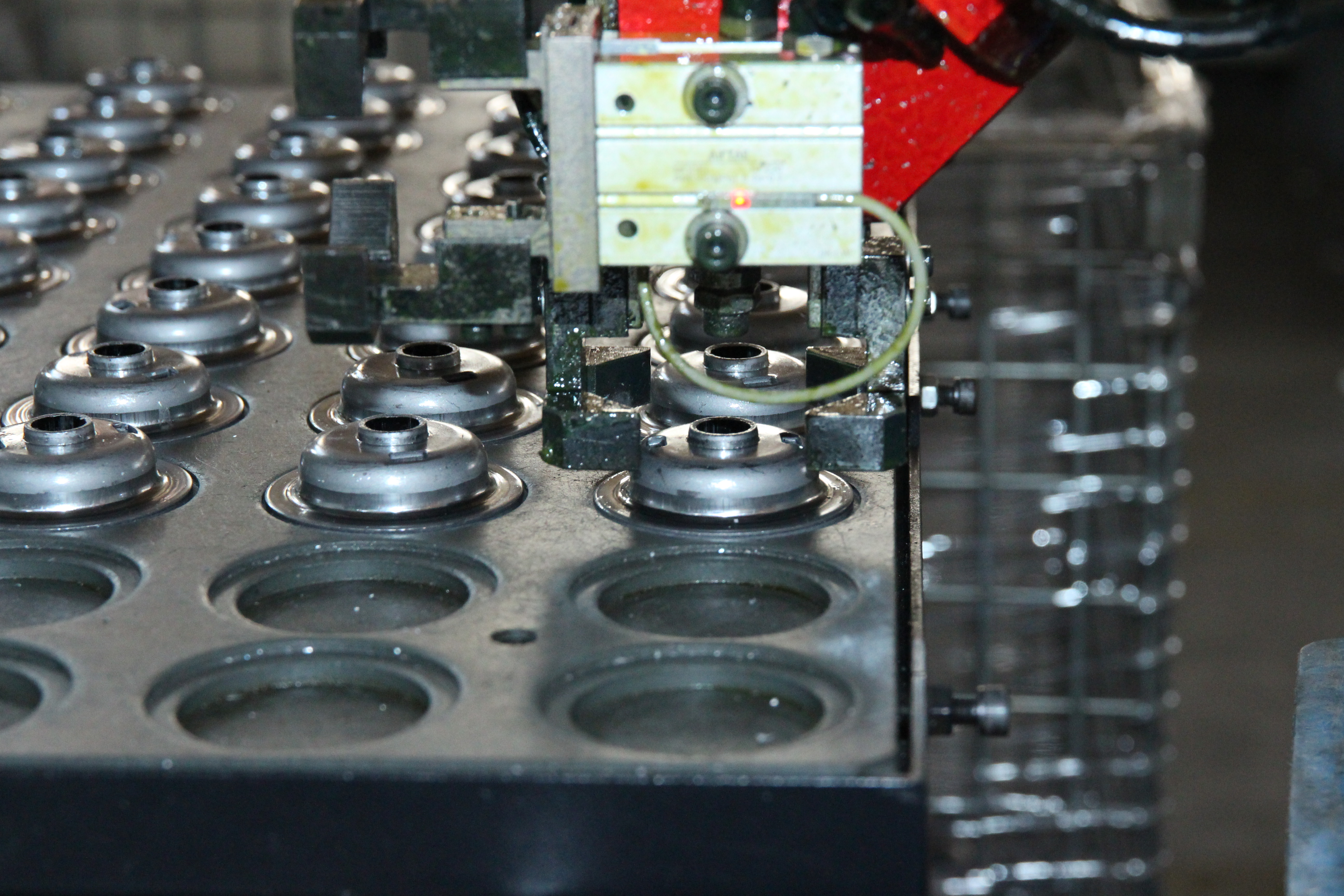 automotive workshop with aftermarket parts and technicians verifying fitment