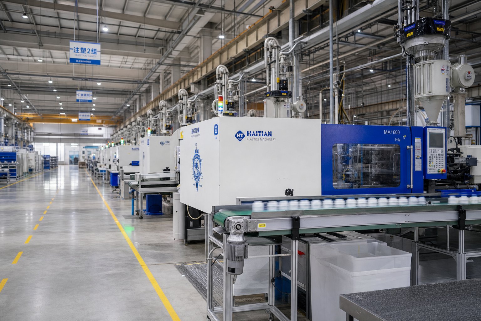 modern plastic machinery production floor featuring multiple processing systems working in concert across a manufacturing facility