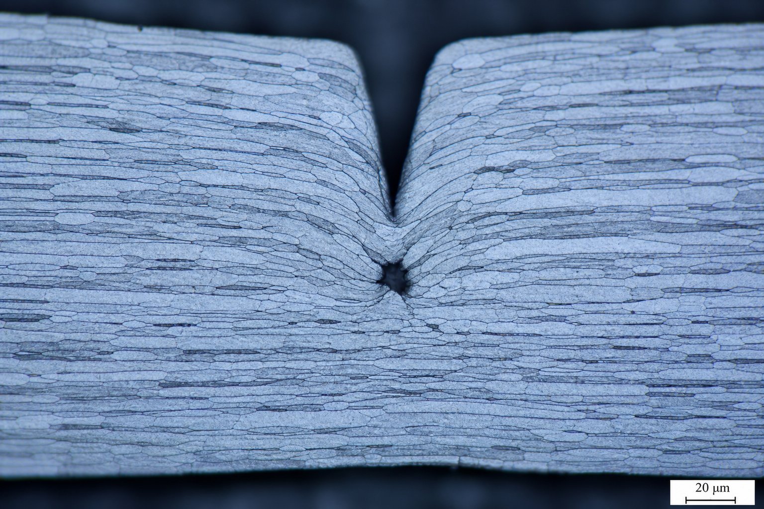 info-1-1 elongated grain structure in rolled sheet metal creates directional properties that influence bypass notch crack behavior