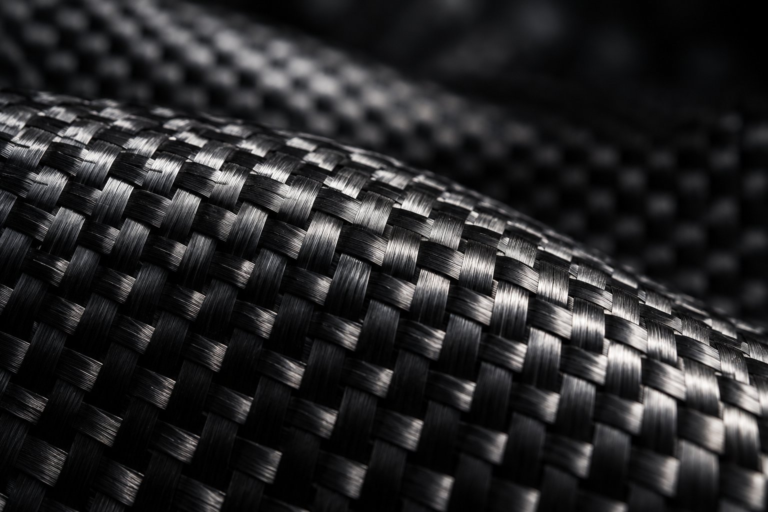 the intricate weave pattern of carbon fiber reflects the complex and costly manufacturing process behind every sheet
